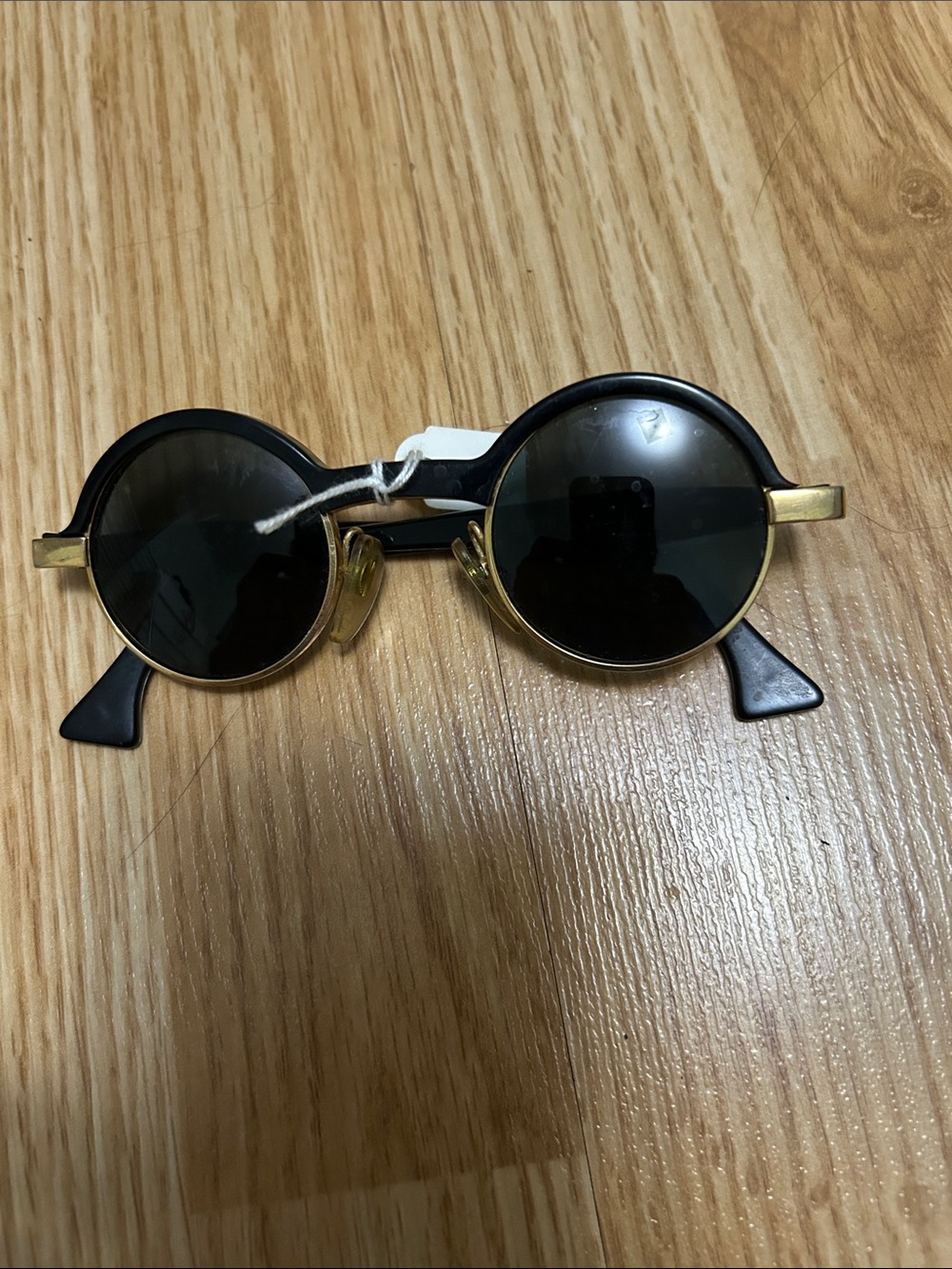 Donna Karan Black and Gold Round Sunglasses